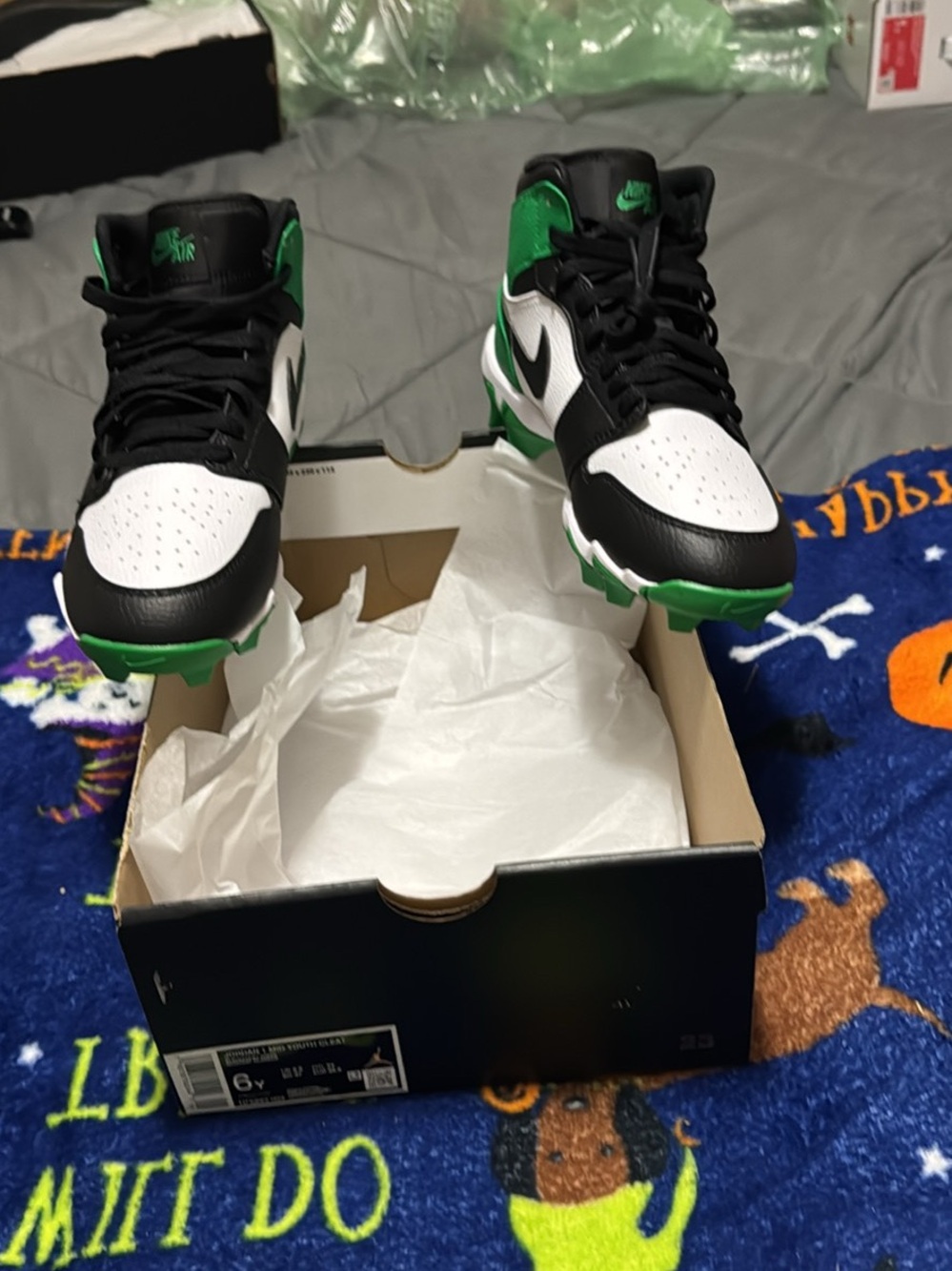 Kids Jordan’s mid Cleat Black White Green